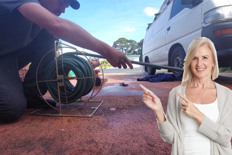 
Tidying up after a day of gutter rinsing, a ulladulla professional stows the hose.