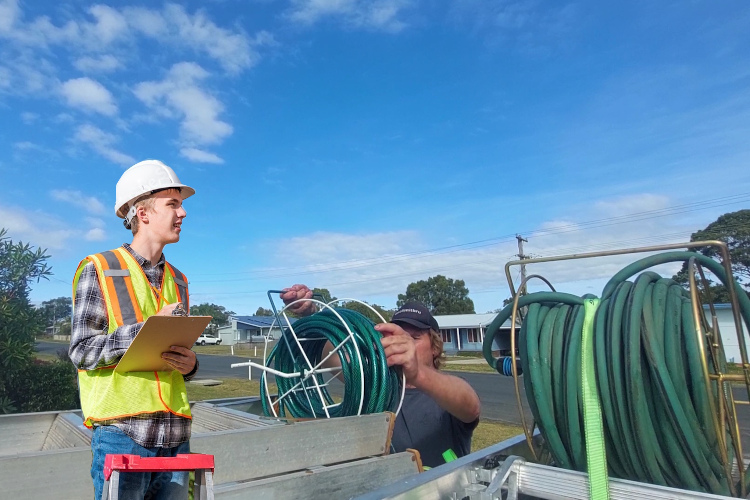 
Hose loading underway as ulladulla gutter cleaner finishes gutter rinsing.