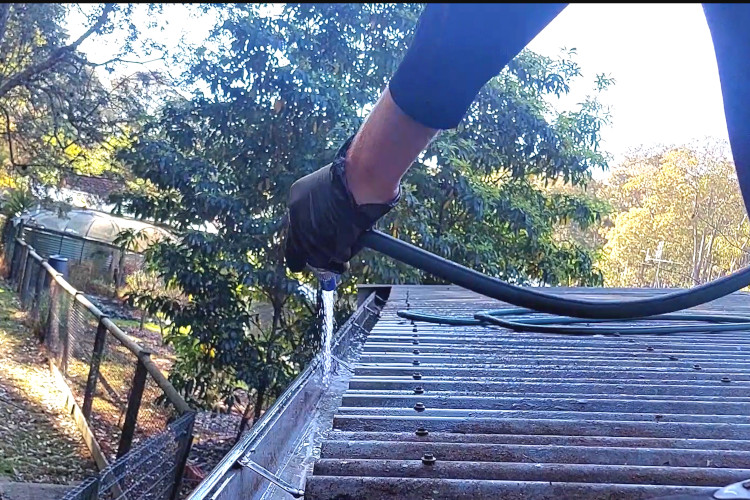 gutter cleaning company in ulladulla uses a simple garden hose to deliver stunning results during gutter clean.